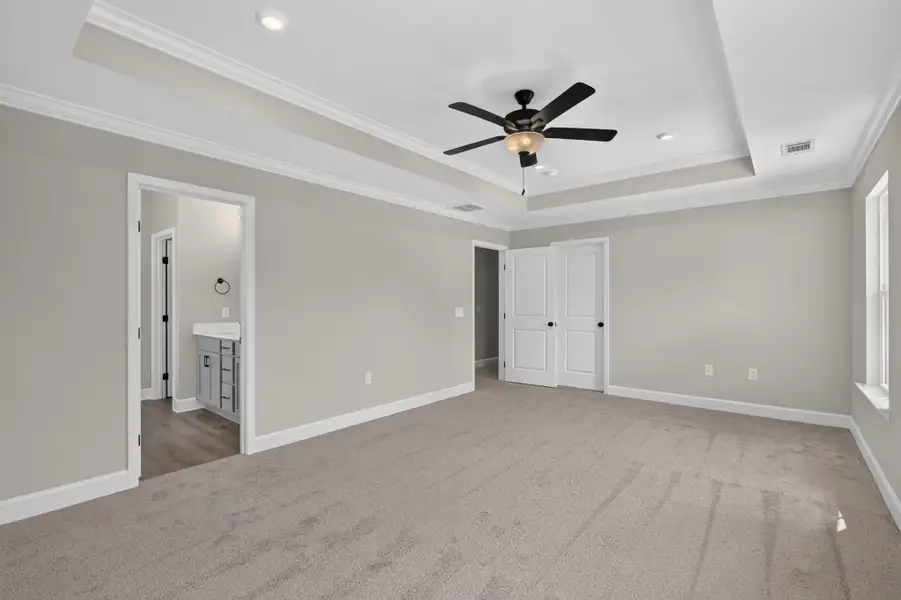 Edisto Primary Bedroom with Tray Ceiling & Crown Molding Edisto Primary Bedroom with Tray Ceiling & Crown Molding