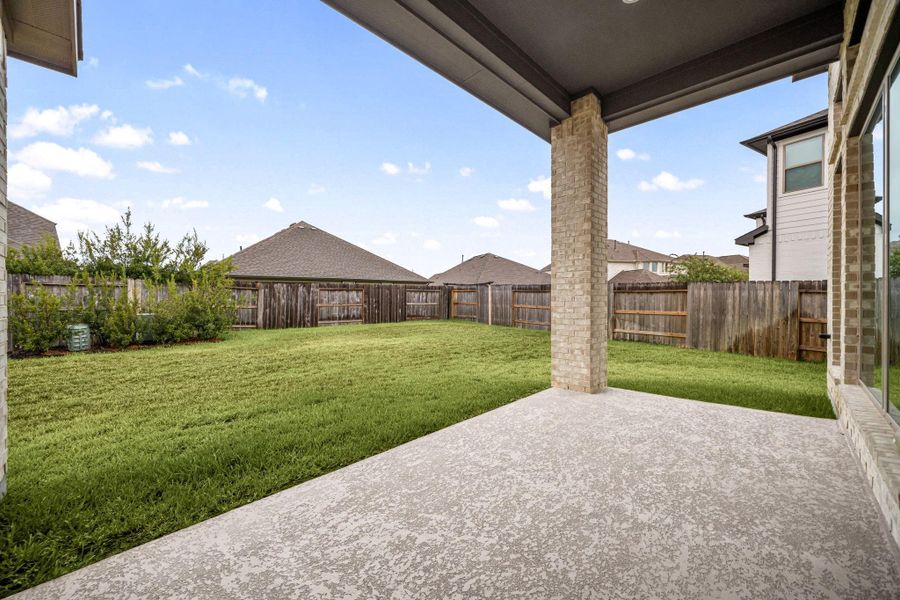 Outside you will find an extended covered patio, great to relax under on those hot summer days.
