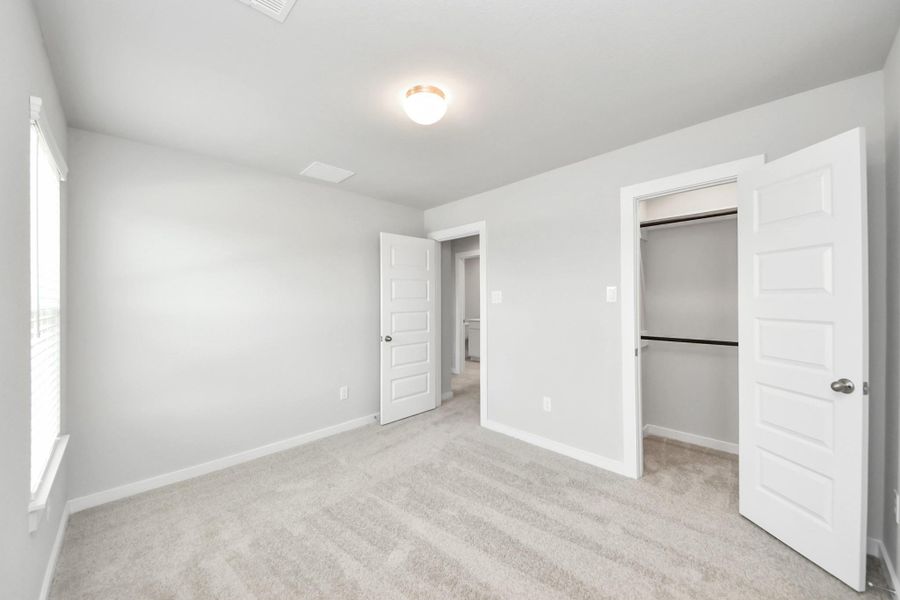 Generously sized secondary bedrooms featuring spacious closets, soft and inviting carpeting underfoot, large windows allowing plenty of natural light, and the added touch of privacy blinds for your personal retreat. Generously sized secondary bedrooms featuring spacious closets, soft and inviting carpeting underfoot, large windows allowing plenty of natural light, and the added touch of privacy blinds for your personal retreat.