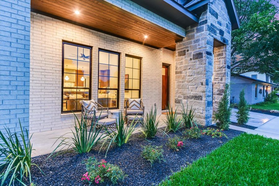 A welcoming brick and stone facade, complemented by lush landscaping and a cozy front porch! A welcoming brick and stone facade, complemented by lush landscaping and a cozy front porch!