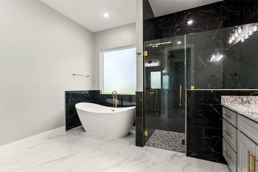 The expansive walk-in shower has a large rain shower head PLUS handheld shower head, bench and hidden recessed shelf to store toiletries. The expansive walk-in shower has a large rain shower head PLUS handheld shower head, bench and hidden recessed shelf to store toiletries.