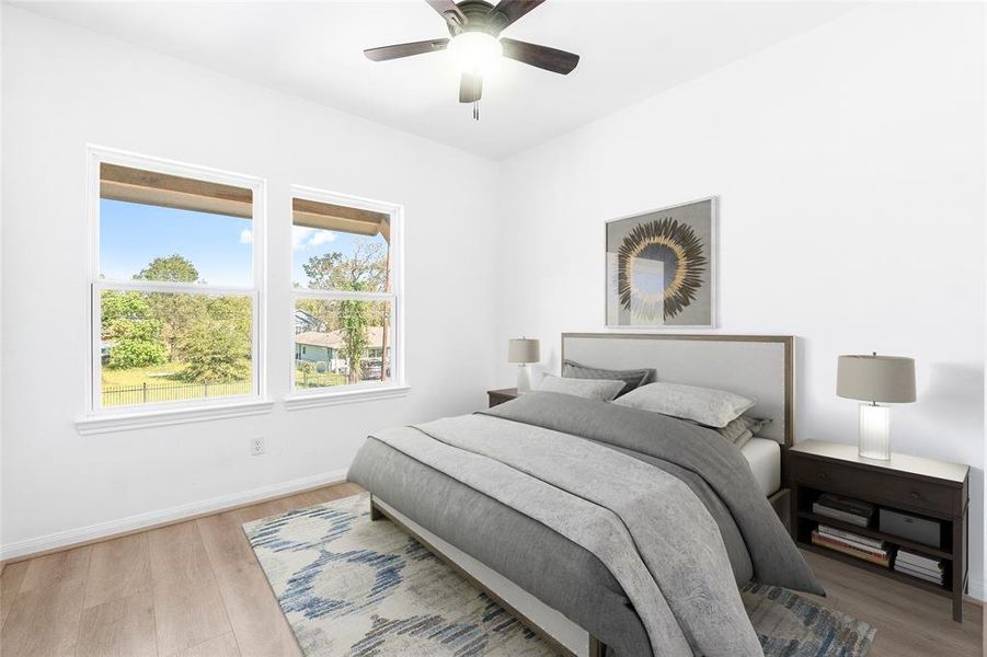 The final bedroom overlooks the front of the home, offering a bright and inviting space with a versatile layout. (Photo may be enhanced and may include virtual staging)