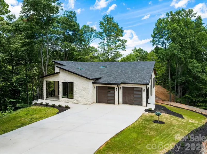 Front exterior of a new home in , Leicester, NC, highlighting curb appeal (Image 2). Front exterior of a new home in , Leicester, NC, highlighting curb appeal (Image 2).