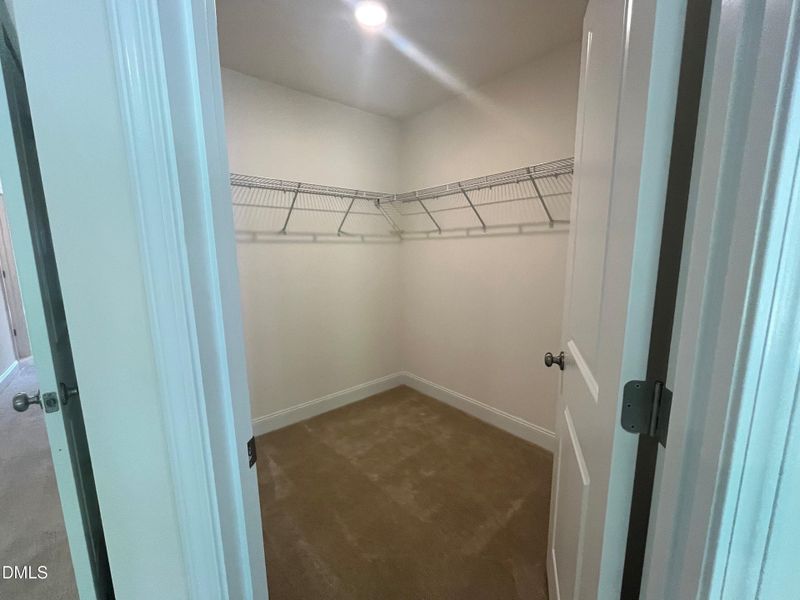 Primary walk in closet Primary walk in closet