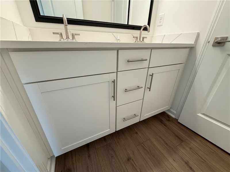 A well-appointed bathroom features a double vanity A well-appointed bathroom features a double vanity