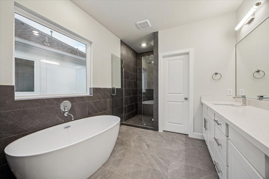 Spacious secondary bath with a beautiful floating tub