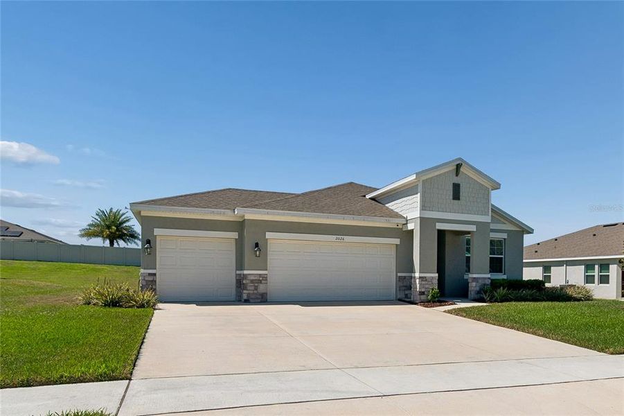 Front exterior of a new home in , Winter Garden, FL, highlighting curb appeal (Image 23). Front exterior of a new home in , Winter Garden, FL, highlighting curb appeal (Image 23).