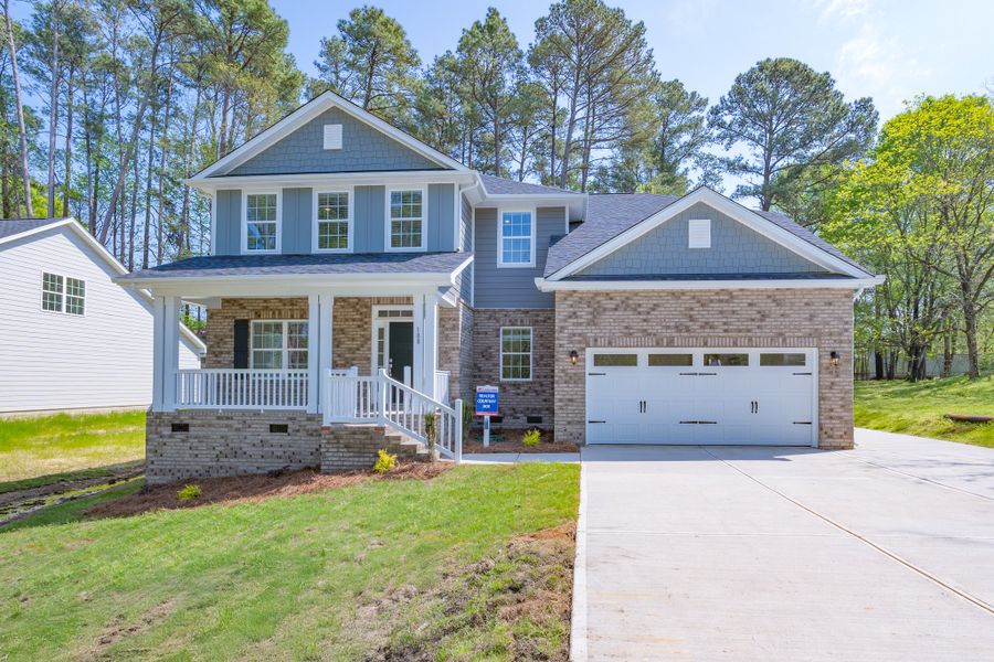 Representative exterior photo of a completed home built from the 3320 by Adams Homes in Falls of the Cape, Lillington, NC (Image 25).
