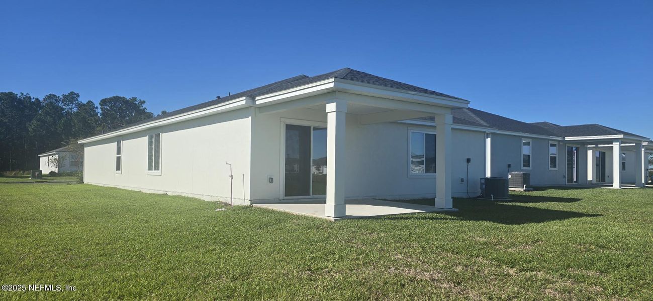 Exterior details and patio area of a home in Lakes at Bella Lago - Signature Series, Green Cove Springs (Image 19). Exterior details and patio area of a home in Lakes at Bella Lago - Signature Series, Green Cove Springs (Image 19).