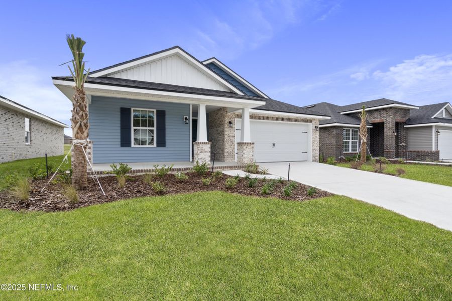 Front exterior of a new home in Shadow Crest at Rolling Hills, Green Cove Springs, FL, highlighting curb appeal (Image 17). Front exterior of a new home in Shadow Crest at Rolling Hills, Green Cove Springs, FL, highlighting curb appeal (Image 17).