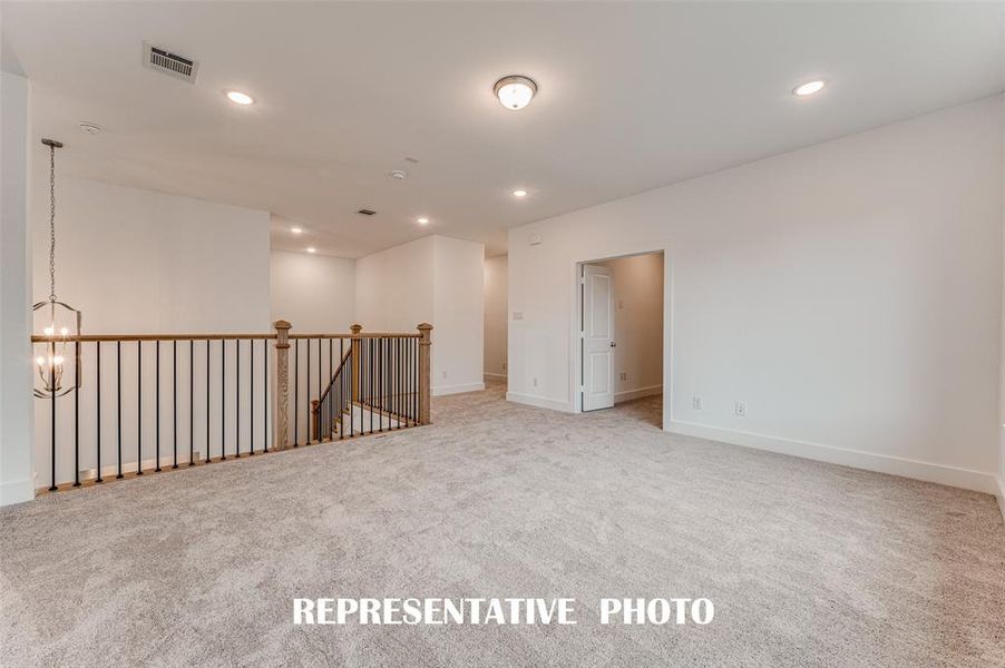 This fantastic game and media room layout is spacious enough to host big game day parties or family game night!  REPRESENTATIVE PHOTO.