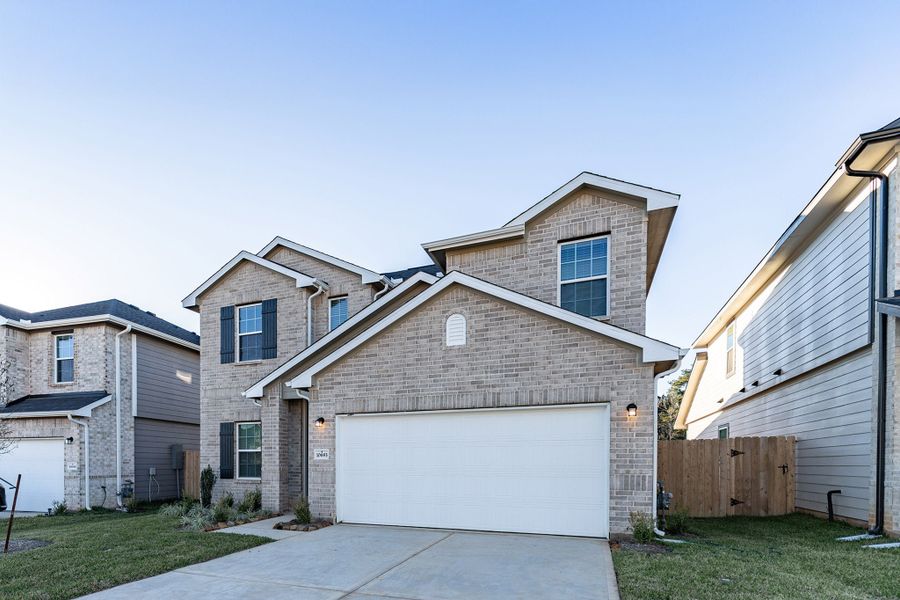 Front exterior of a new home in Cielo, Conroe, TX, highlighting curb appeal (Image 2).