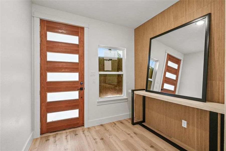 Doorway to outside featuring light hardwood / wood-style flooring