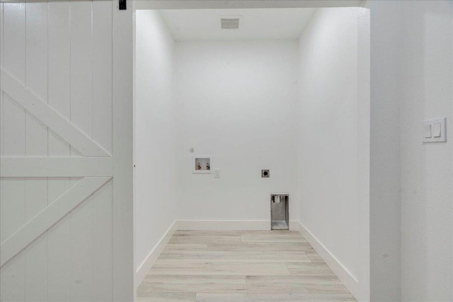 Guest Home Laundry room with electric dryer hookup, hookup for a washing machine