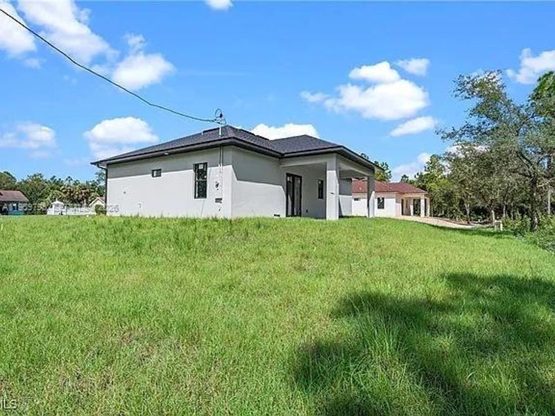Exterior details and patio area of a home in , Lehigh Acres (Image 3).