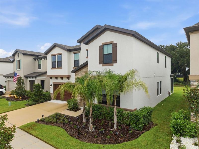 Front exterior of a new home in Hawkstone, Lithia, FL, highlighting curb appeal (Image 27).