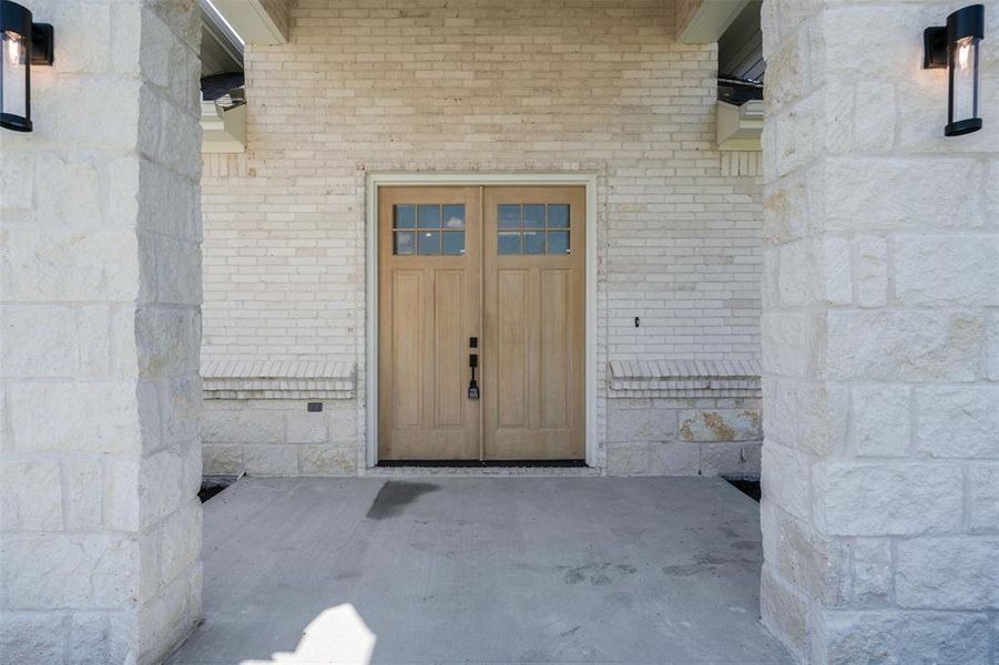 Property entrance with brick siding Property entrance with brick siding