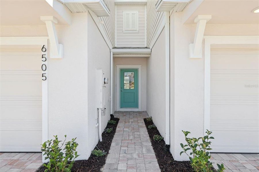 Exterior details and patio area of a home in Cyrene at Harmony, St. Cloud (Image 3).