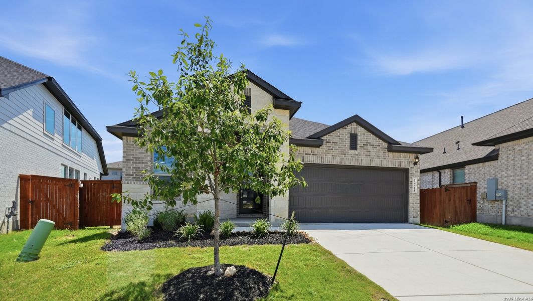 Front exterior of a new home in Stillwater Ranch, San Antonio, TX, highlighting curb appeal (Image 21). Front exterior of a new home in Stillwater Ranch, San Antonio, TX, highlighting curb appeal (Image 21).