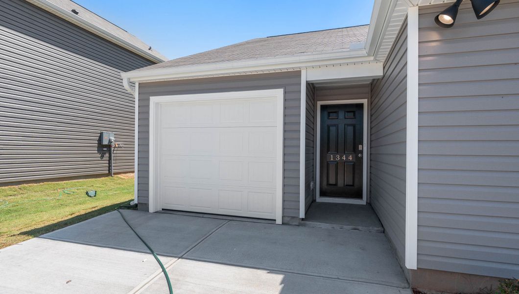 Front exterior of a new home in Harper Ridge, Roebuck, SC, highlighting curb appeal (Image 2).