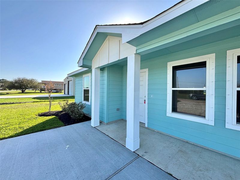 Front exterior of a new home in , Palacios, TX, highlighting curb appeal (Image 1).