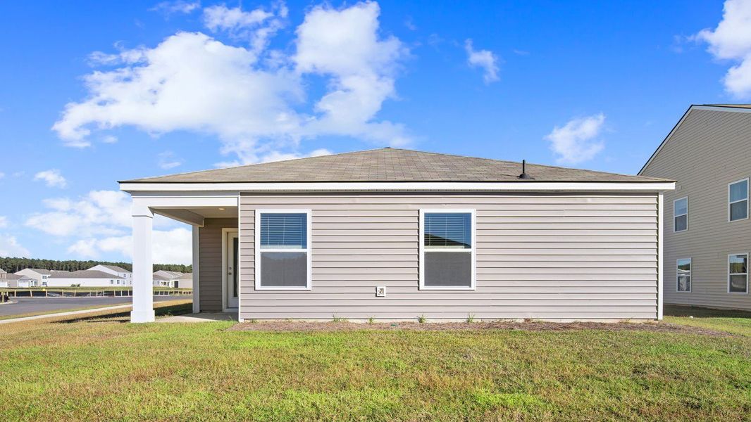Exterior details and patio area of a home in Palm Ridge, Guyton (Image 4).