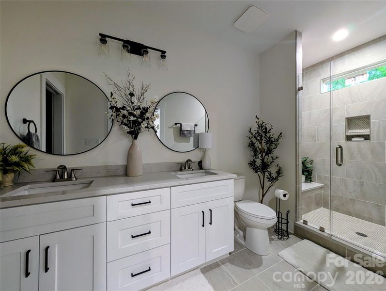 Ensuite bath toward glass-enclosed shower. Ensuite bath toward glass-enclosed shower.