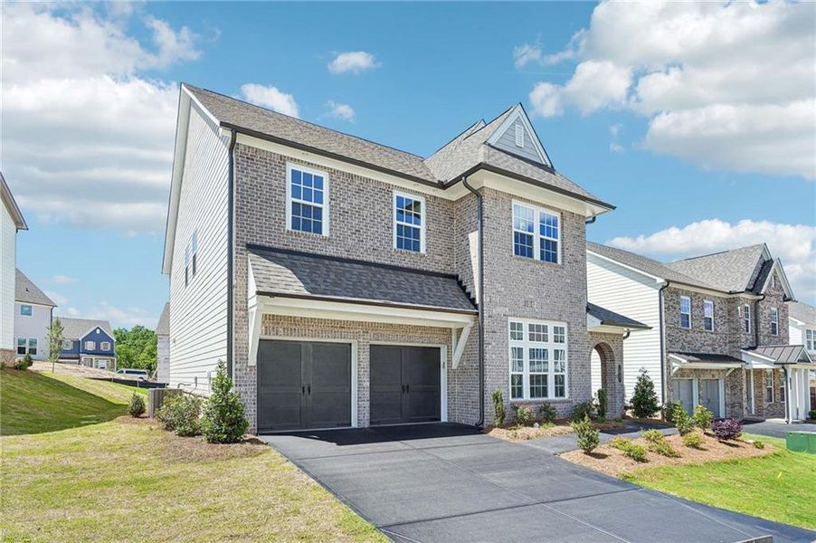 Front exterior of a new home in East Harbor II at Chestatee, Dawsonville, GA, highlighting curb appeal (Image 1).