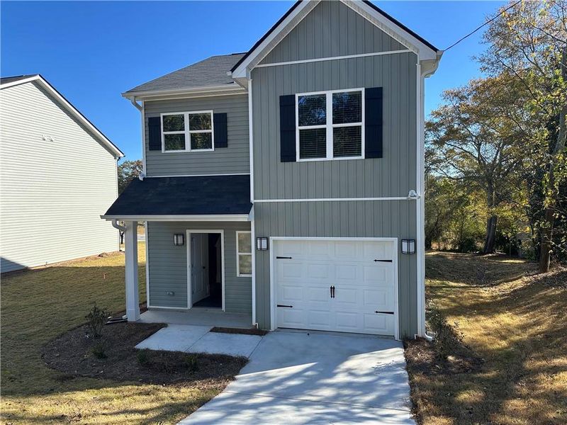 Front exterior of a new home in , Toccoa, GA, highlighting curb appeal (Image 1). Front exterior of a new home in , Toccoa, GA, highlighting curb appeal (Image 1).