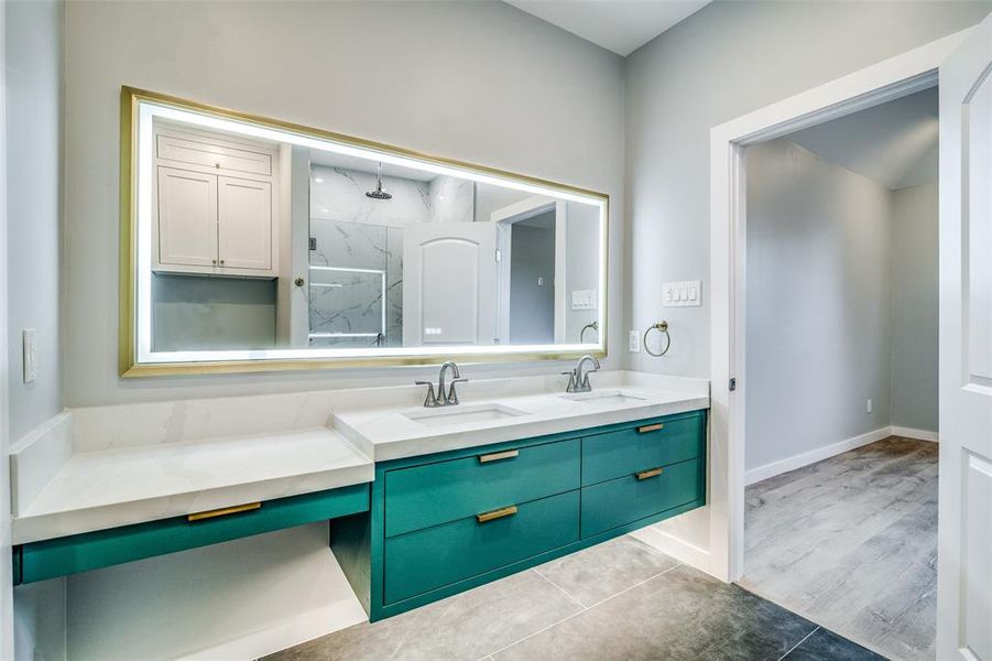 Bathroom with hardwood / wood-style flooring, vanity, and walk in shower