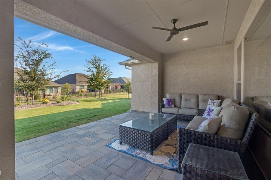 The large covered back patio has been finished with pavers.