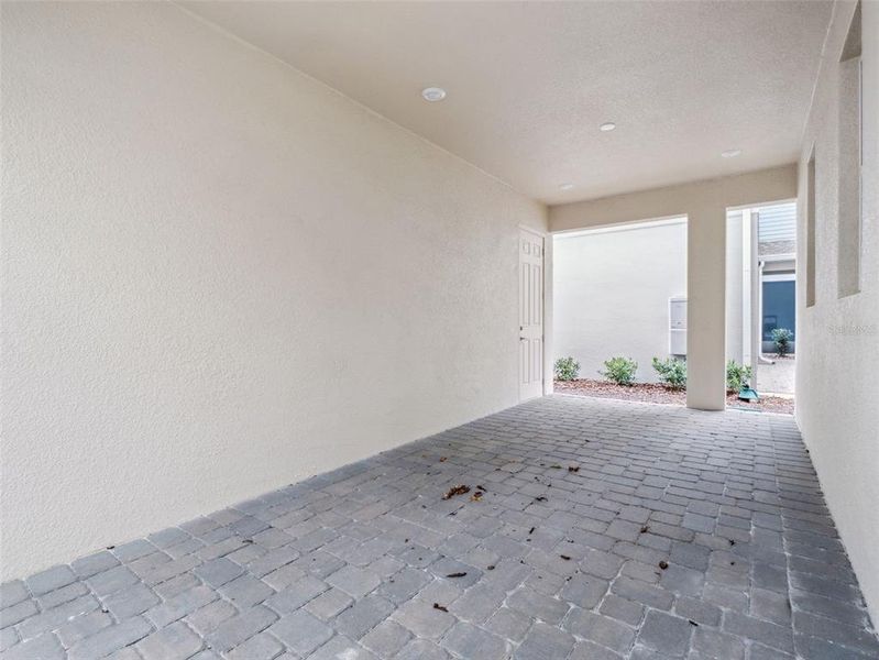 Exterior details and patio area of a home in Harvest at Ovation, Winter Garden (Image 4).