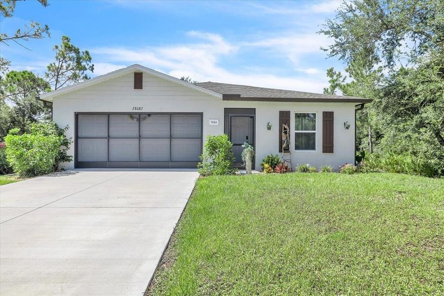 Front exterior of a new home in , Punta Gorda, FL, highlighting curb appeal (Image 23). Front exterior of a new home in , Punta Gorda, FL, highlighting curb appeal (Image 23).