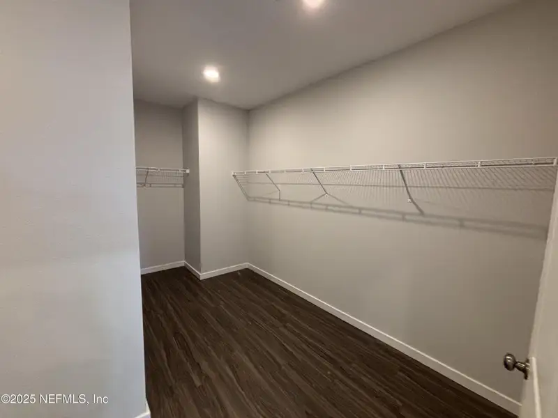 Spacious, unfurnished interior of a new home in The Cypress Series at Reserve East, Flagler Beach (Image 14).