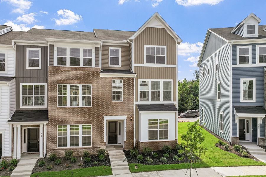 Front exterior of a new home in Renaissance at White Oak, Garner, NC, highlighting curb appeal (Image 24). Front exterior of a new home in Renaissance at White Oak, Garner, NC, highlighting curb appeal (Image 24).