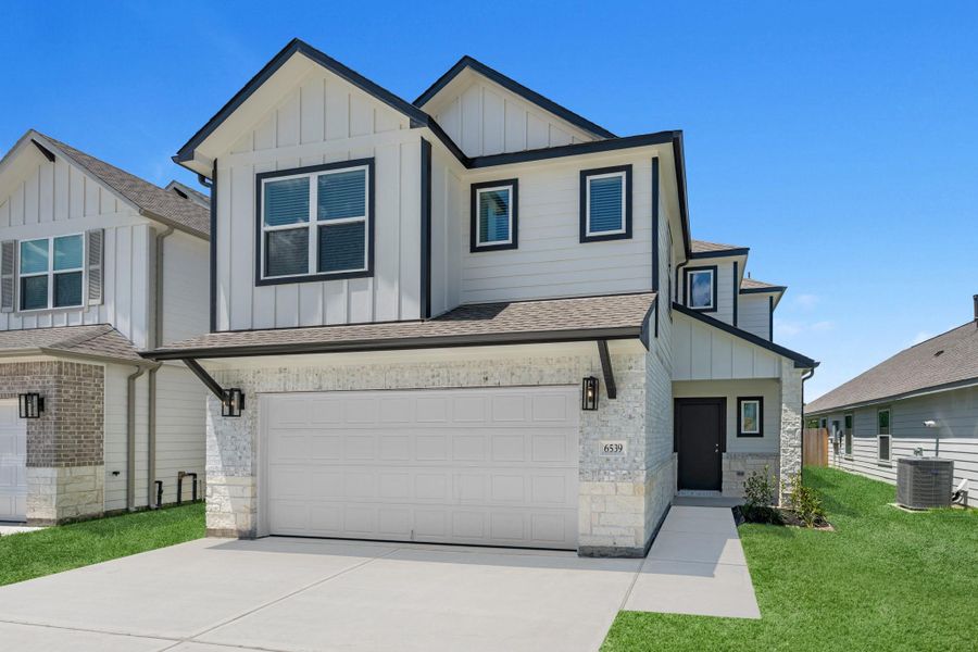 Front exterior of a new home in Cypresswood Landing, Humble, TX, highlighting curb appeal (Image 14). Front exterior of a new home in Cypresswood Landing, Humble, TX, highlighting curb appeal (Image 14).