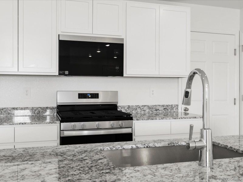 Furnished interior view inside a new home in Skyview at High Point, Aurora (Image 9).