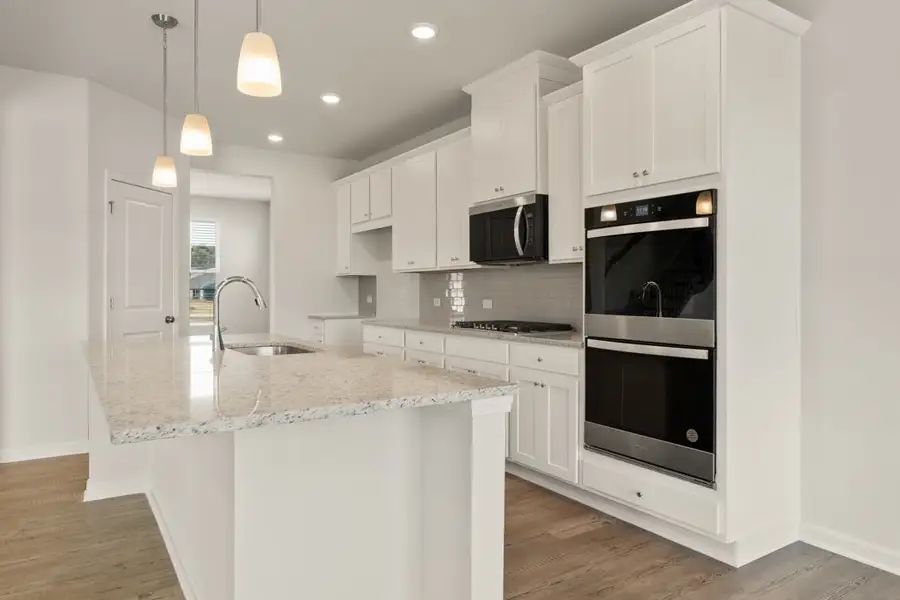 A kitchen with white cabinets. A kitchen with white cabinets.