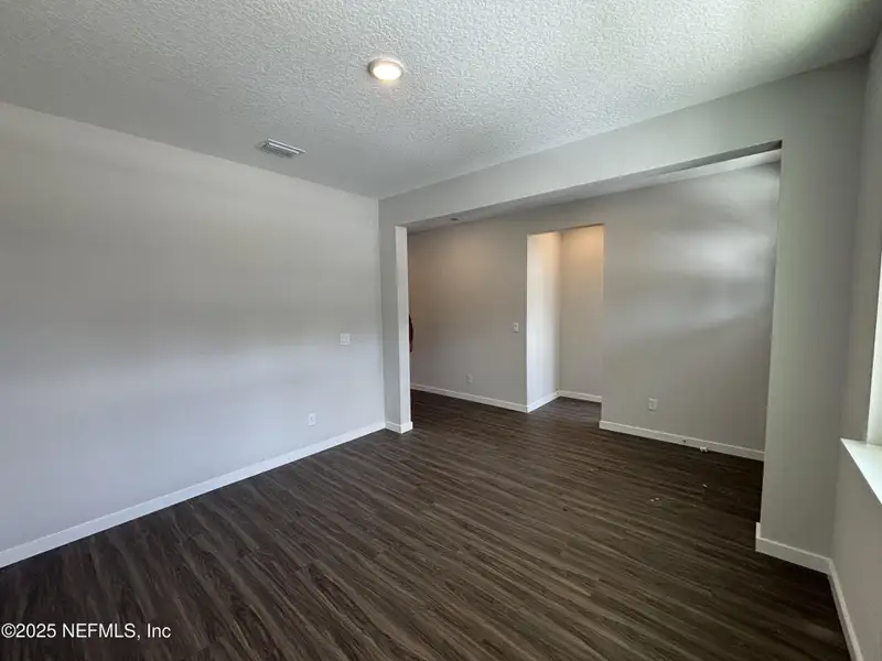 Spacious, unfurnished interior of a new home in The Cypress Series at Reserve East, Flagler Beach (Image 21).