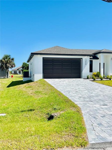Front exterior of a new home in , Port Charlotte, FL, highlighting curb appeal (Image 30).