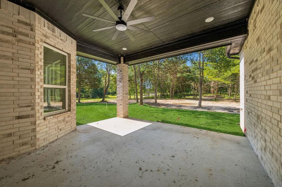 Covered patio featuring a ceiling fan and an amazing view.