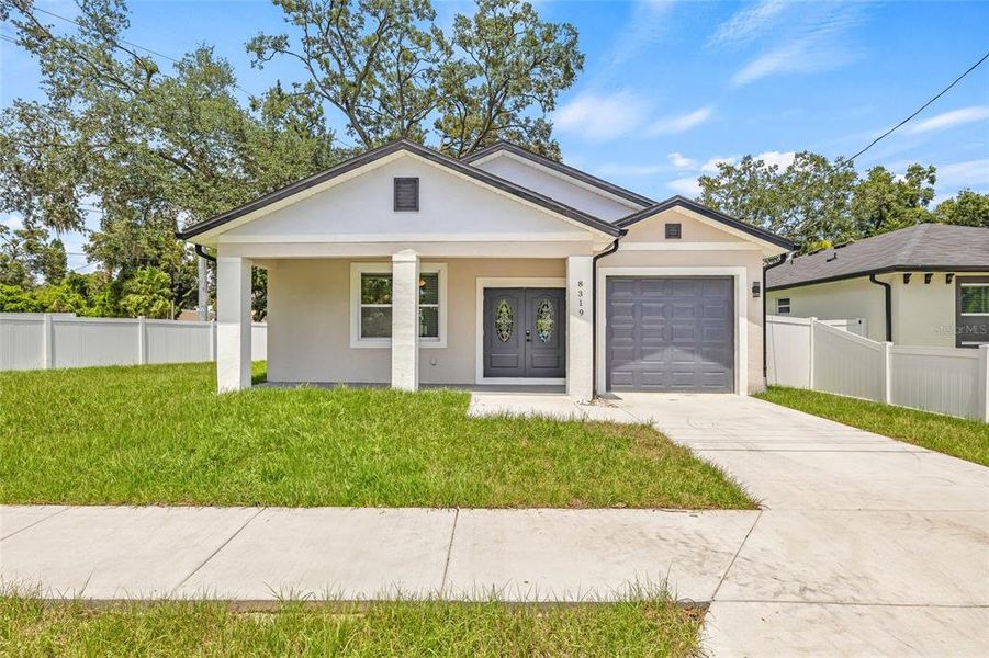 Front exterior of a new home in , Tampa, FL, highlighting curb appeal (Image 1).