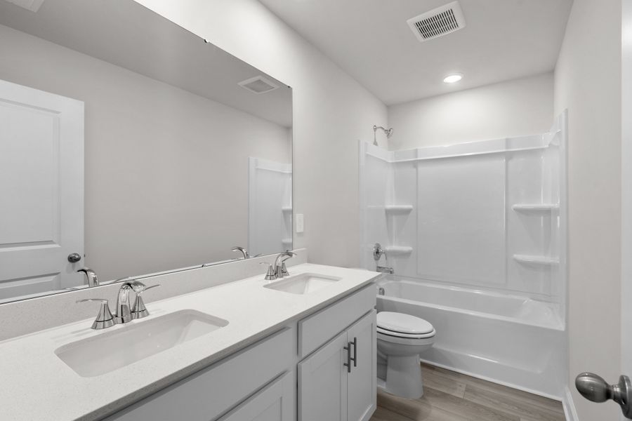 Furnished interior view inside a new home in Cypress Ridge - The Boardwalk Series, Longs (Image 11).