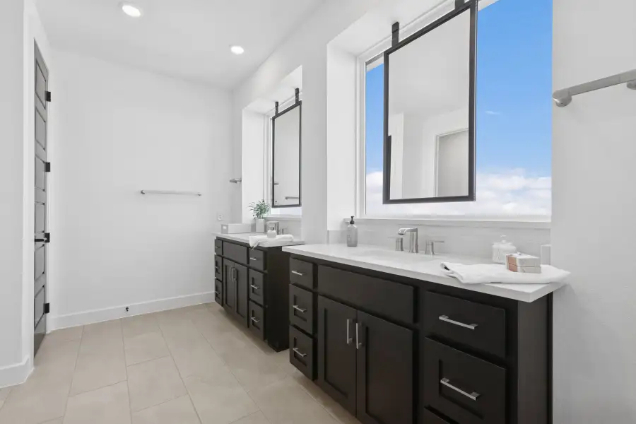 Furnished interior view inside a new home in The Point at Rough Hollow, Lakeway (Image 6).