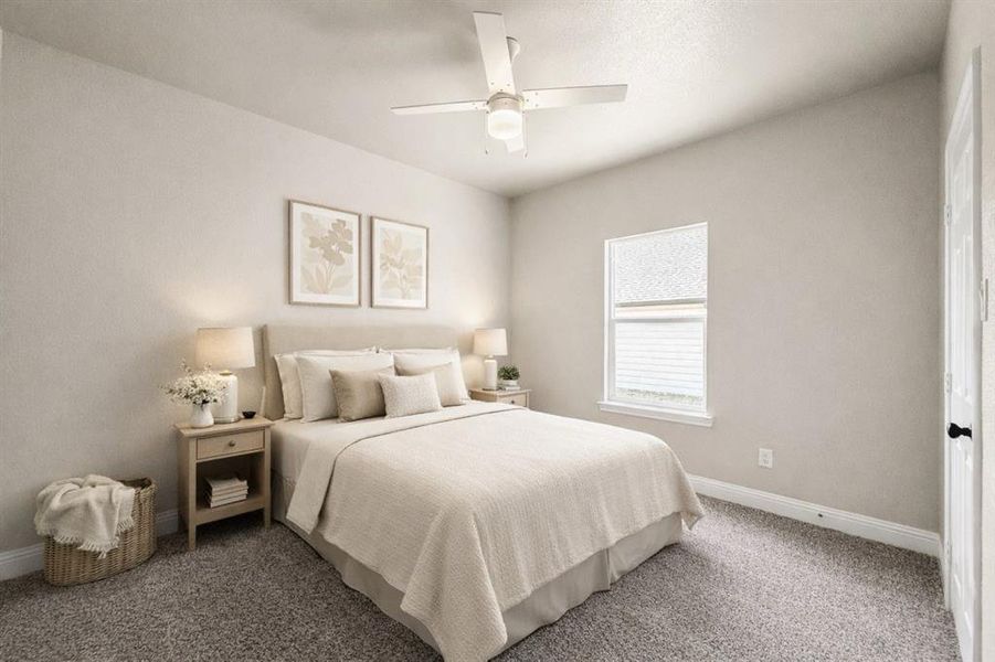 Bedroom with a ceiling fan and carpet floors