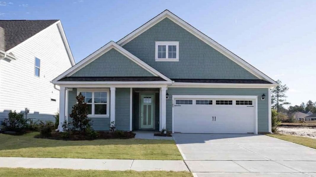 Front exterior of a new home in The Haven at Indigo Preserve, Leland, NC, highlighting curb appeal (Image 1). Front exterior of a new home in The Haven at Indigo Preserve, Leland, NC, highlighting curb appeal (Image 1).
