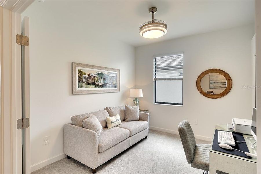 3rd Bedroom showing an office set up with sofa bed