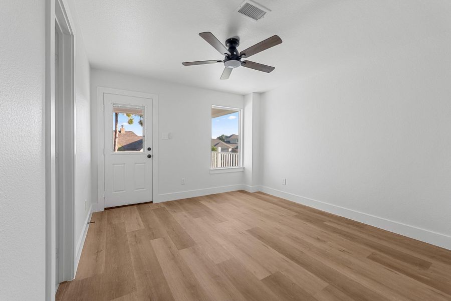 Secondary bedroom with direct access to a spacious front porch deck. Secondary bedroom with direct access to a spacious front porch deck.