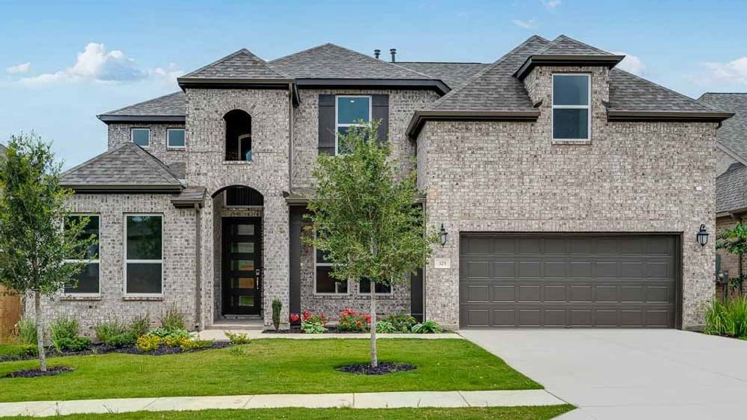 Representative exterior photo of a completed home built from the Peridot by Taylor Morrison in Parkside on the River 60s, Georgetown, TX (Image 1).