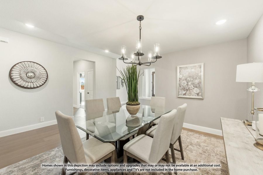 Dining room with glass-top table, six upholstered chairs, and a metal chandelier overhead